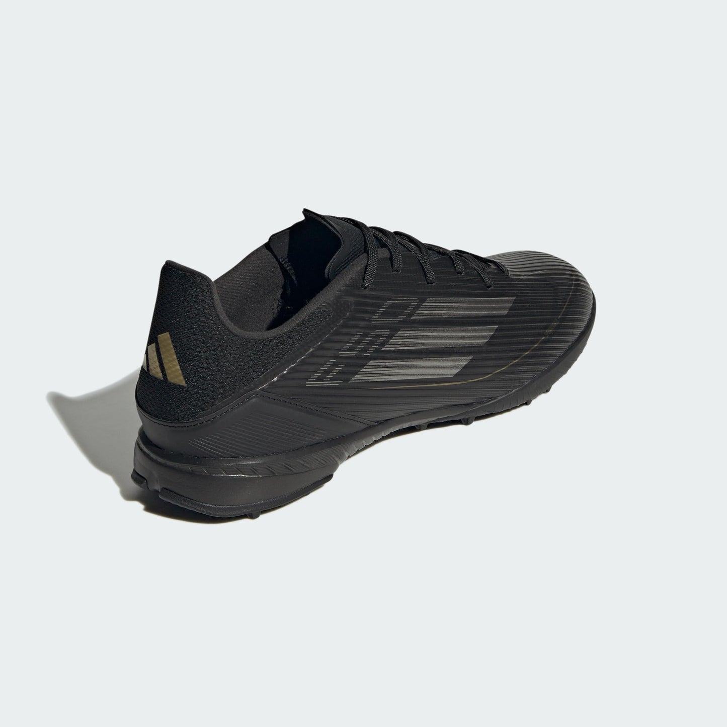 adidas Unisex F50 League Turf Sneaker, Black/Iron Metallic/Gold Metallic, 10 US Men